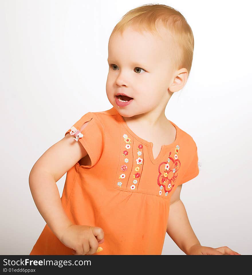 Studio portrait of a little girl playing in the tag. Studio portrait of a little girl playing in the tag