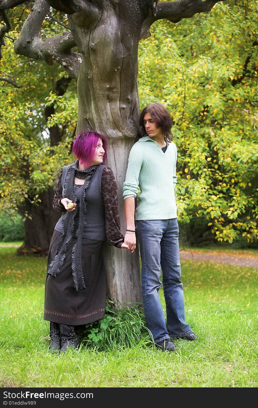 Young and beautiful boy  and girl  walking in park. Young and beautiful boy  and girl  walking in park