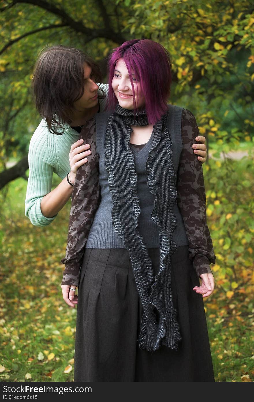 Young and beautiful boy  and girl  walking in park. Young and beautiful boy  and girl  walking in park