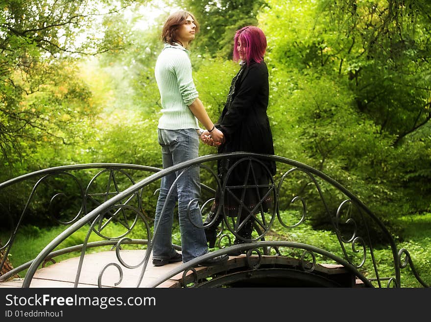 Young and beautiful boy  and girl  walking in park. Young and beautiful boy  and girl  walking in park