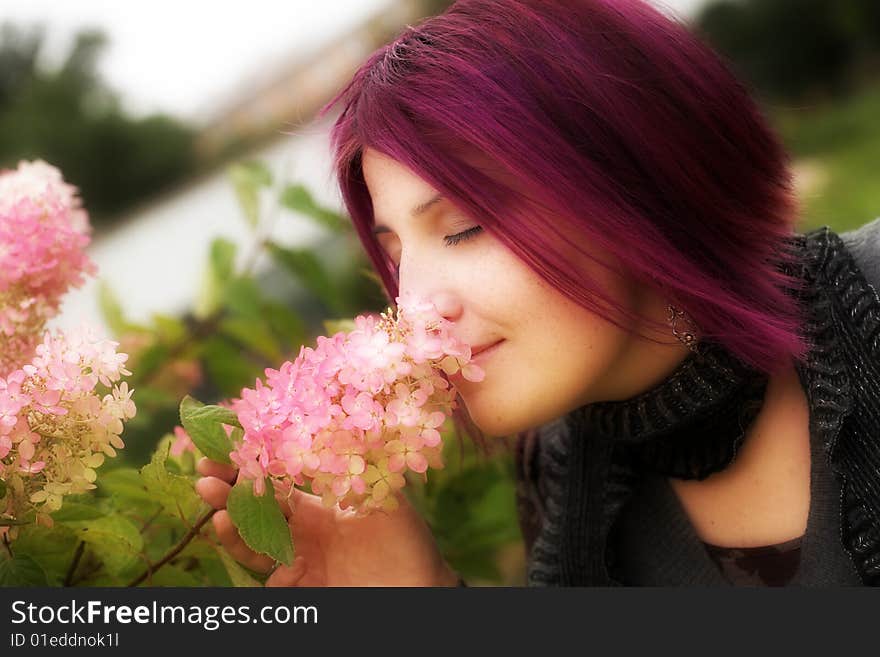 Woman relaxing in the summer park