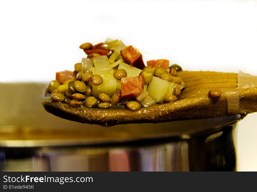 Spoon detail with lentils, cooking. Spoon detail with lentils, cooking