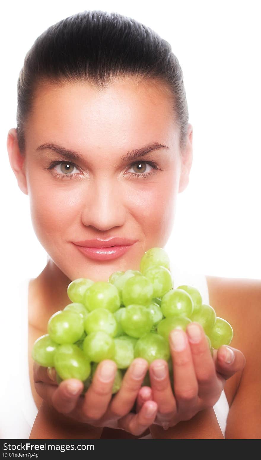 Studio portrait of a girl with a bunch of grapes isolated on white background. Studio portrait of a girl with a bunch of grapes isolated on white background