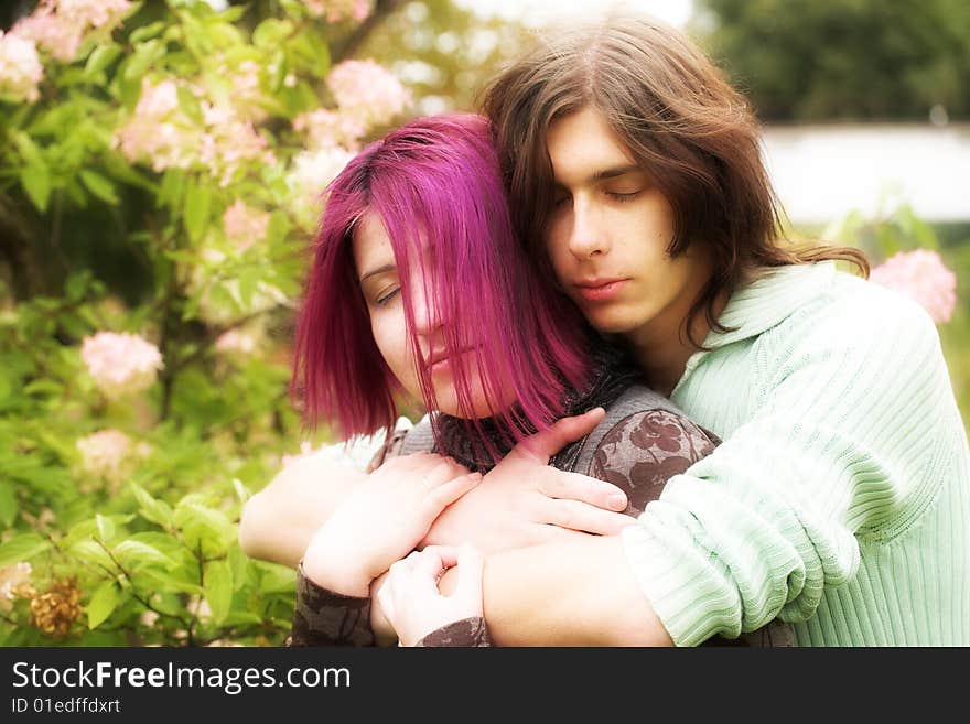 Young and beautiful boy  and girl  walking in park. Young and beautiful boy  and girl  walking in park