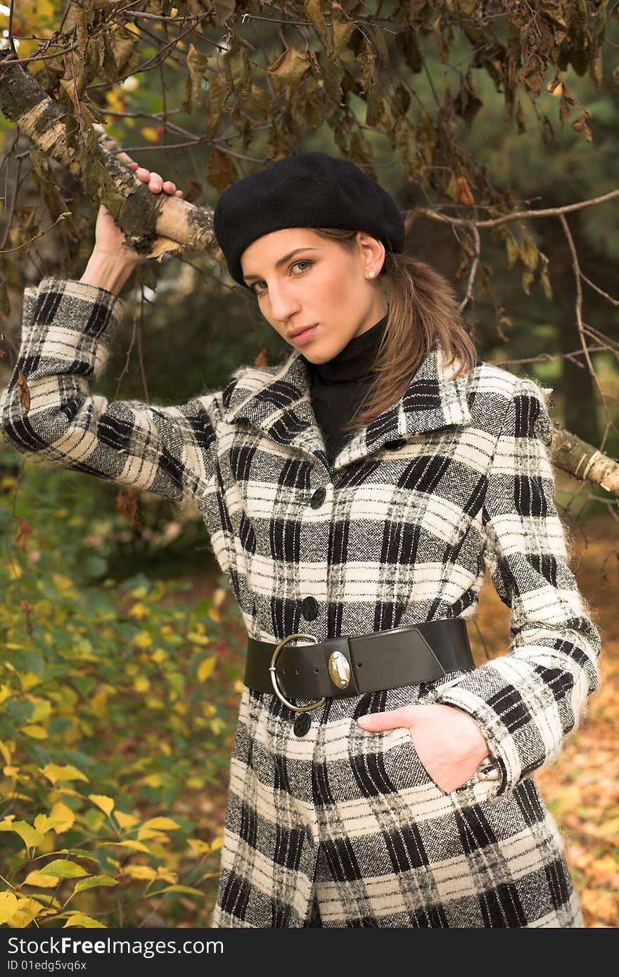 Young woman in autumnal park