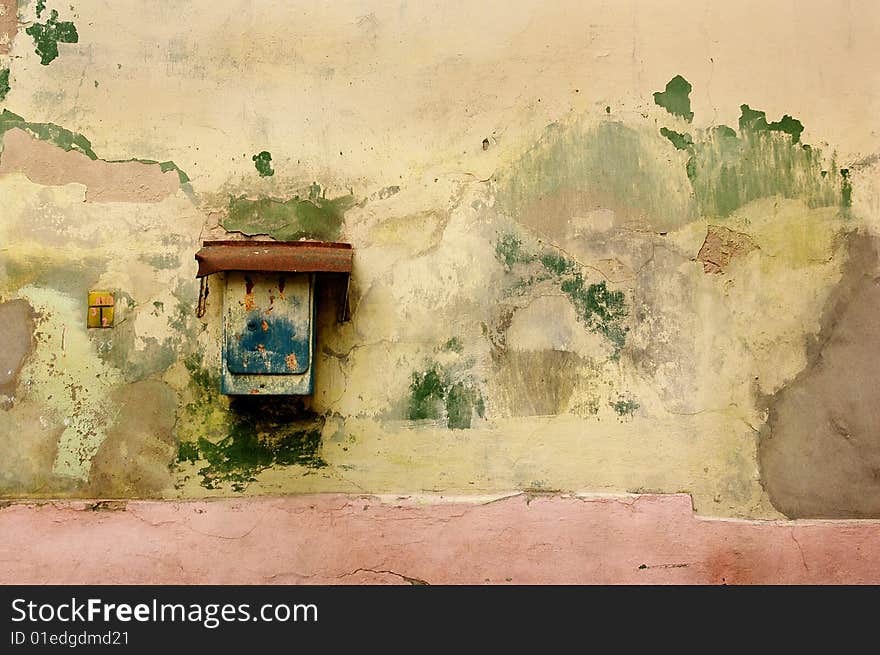 Rusty Mailbox On Old Wall