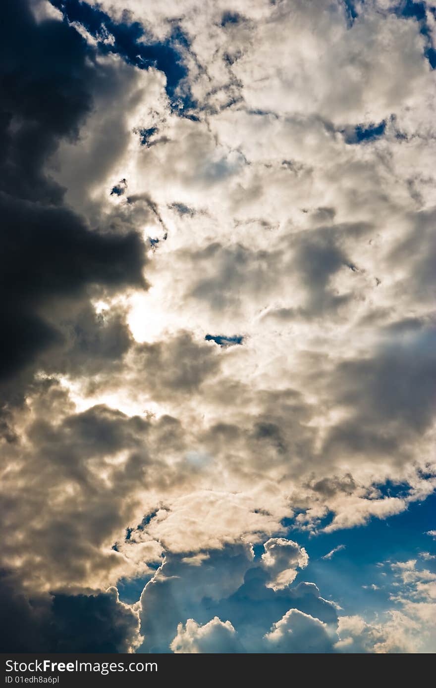 Cloudscape with sun ray shining through.