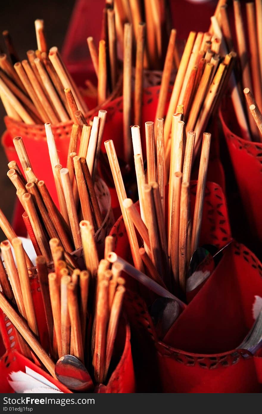 Handmade chopsticks inside open containers. Handmade chopsticks inside open containers