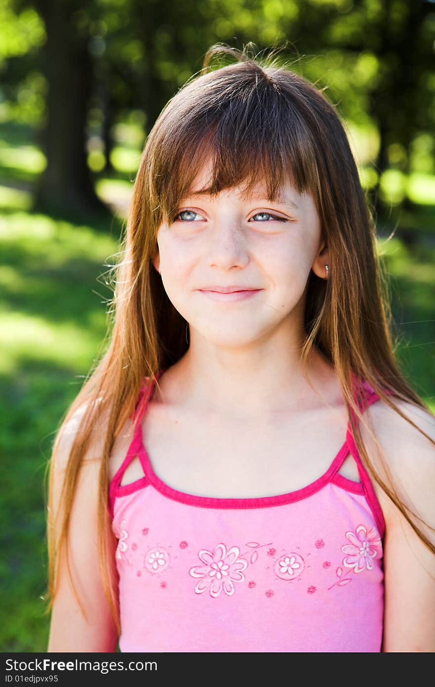 Portrait of young blond girl playing in the park. Portrait of young blond girl playing in the park