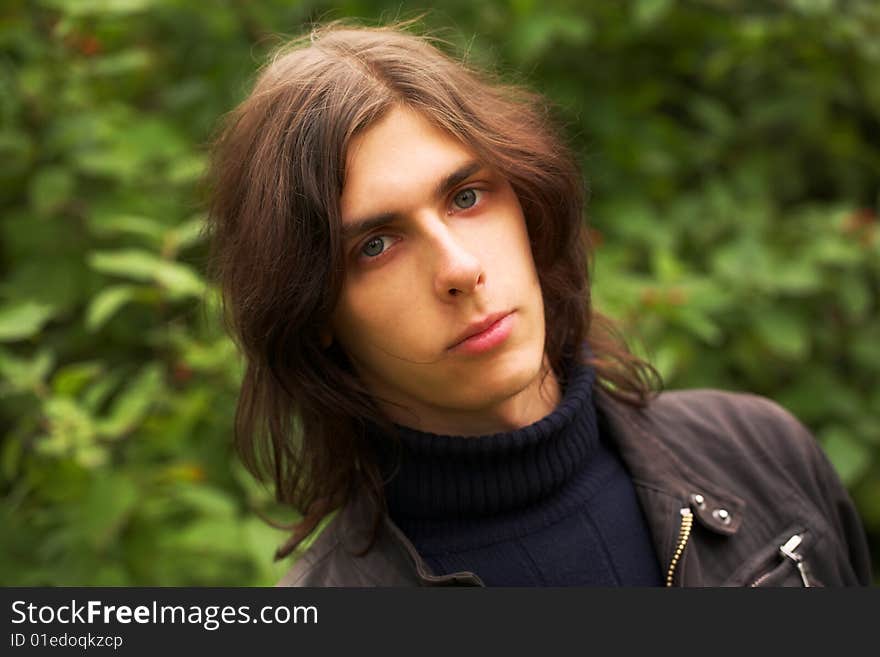 Handsome young man during his walk in a park