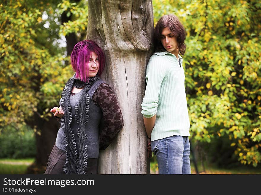 Portrait of a loving couple in a park. Portrait of a loving couple in a park