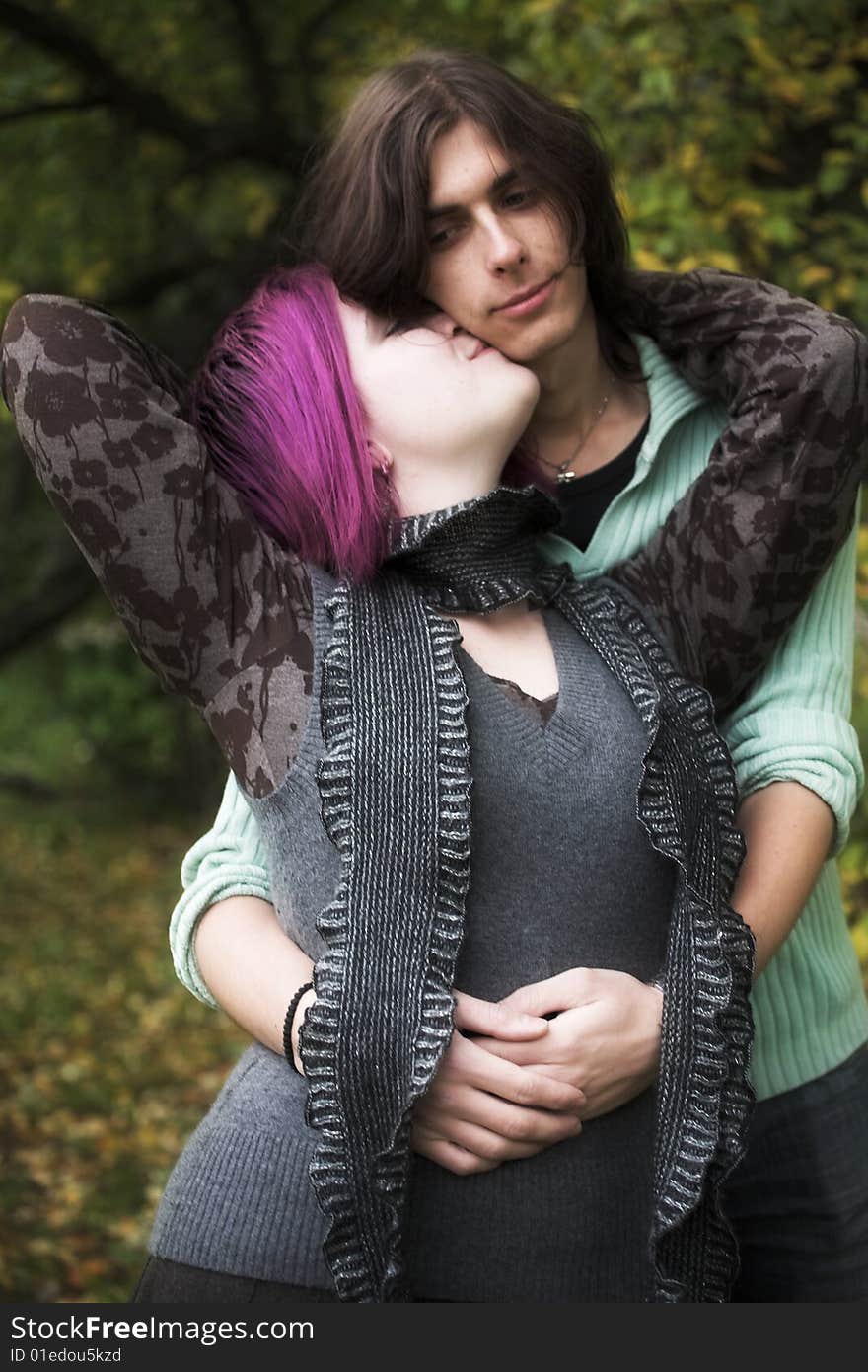 Portrait of a loving couple in a park. Portrait of a loving couple in a park