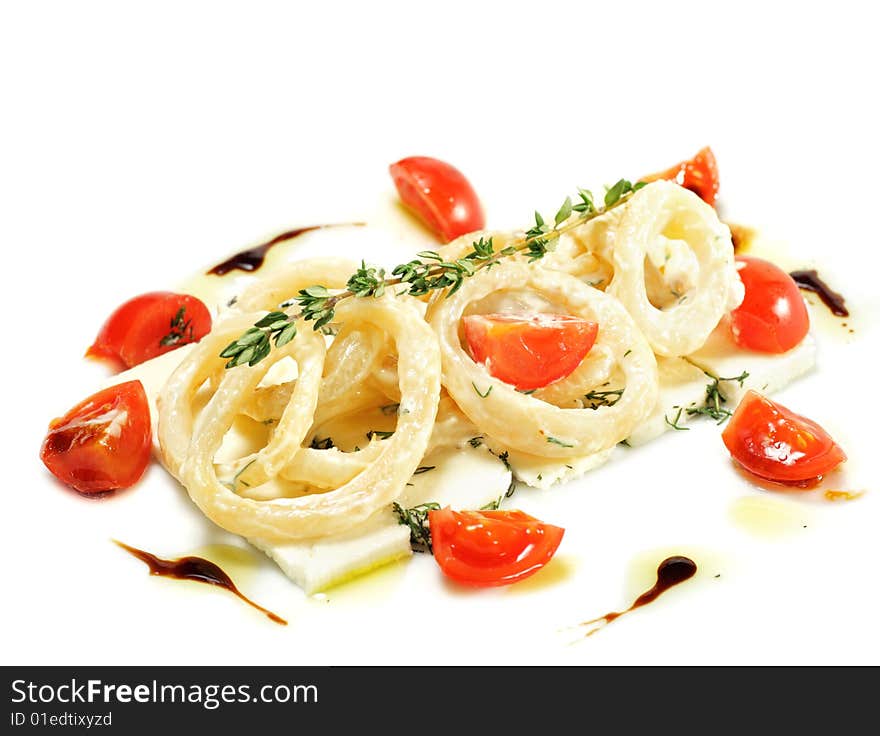 Salad with Calamari Rings, Sheep Cheese and Tomato. Isolated on White Background. Salad with Calamari Rings, Sheep Cheese and Tomato. Isolated on White Background