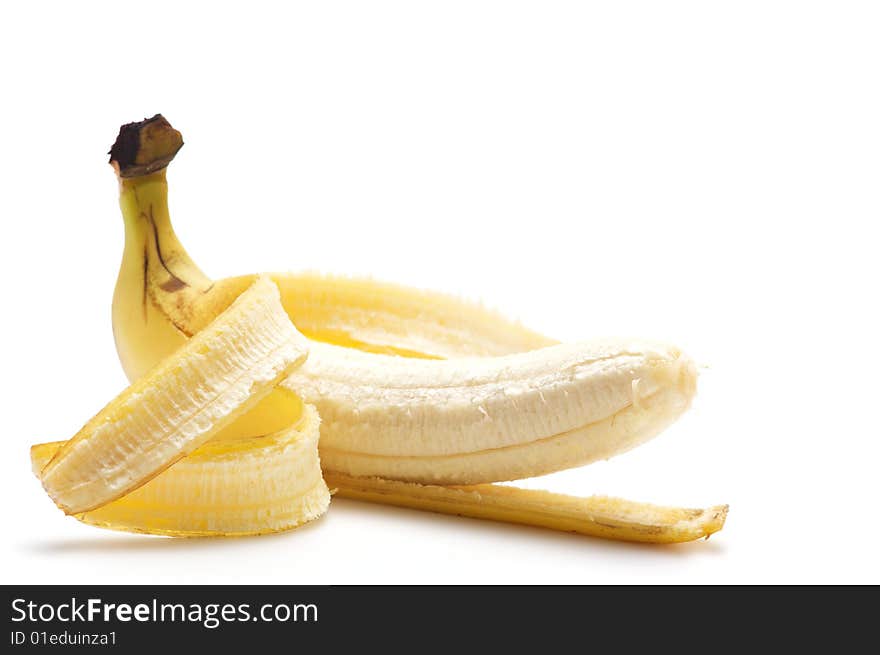 Cleaned banana isolated on a white background.