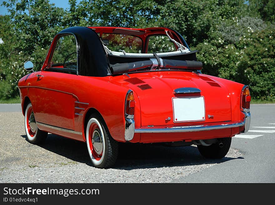 Parked small red sports car. Parked small red sports car