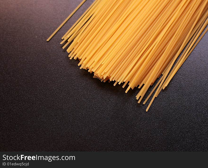 Italian spaghetti on a black background