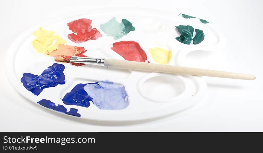 Palette With Paints And Paintbrush