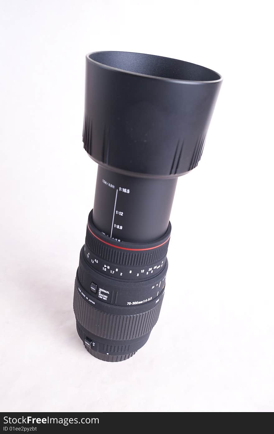 Telephoto lens for digital slr, extended with lens-hood on.