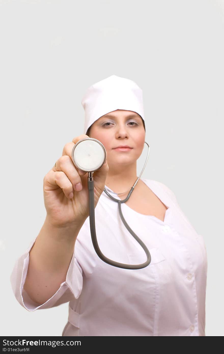 Young woman with stethoscope.Isolated.