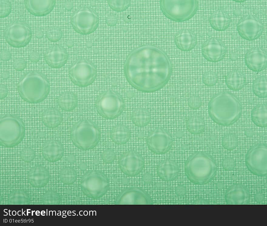 Water drops on plastic surface, macro shot, bottom view. Water drops on plastic surface, macro shot, bottom view