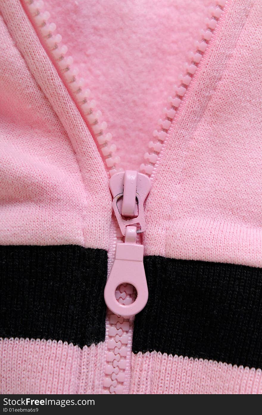 Closeup detail of pink zipper. Closeup detail of pink zipper