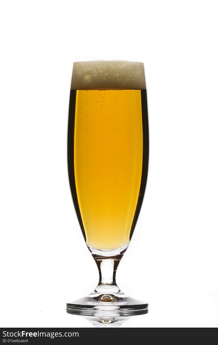 Glass of beer on white background