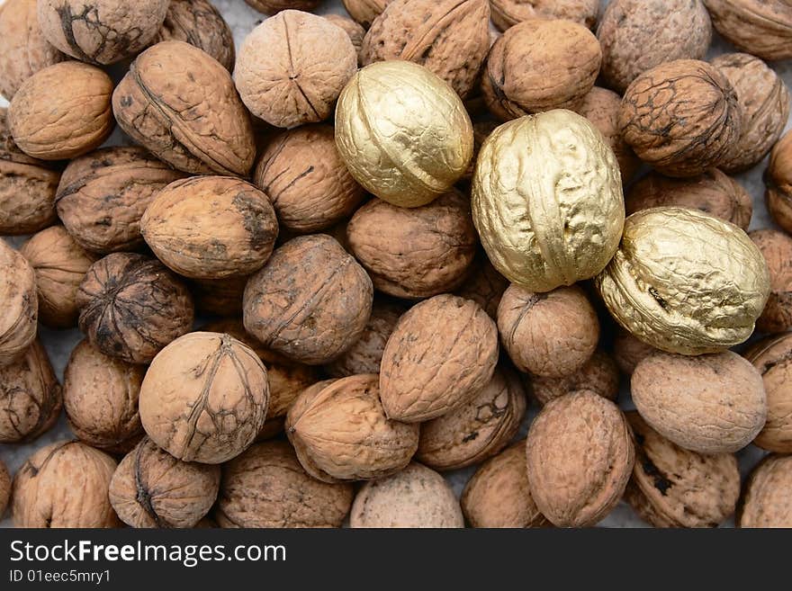 Walnuts usual and golden background