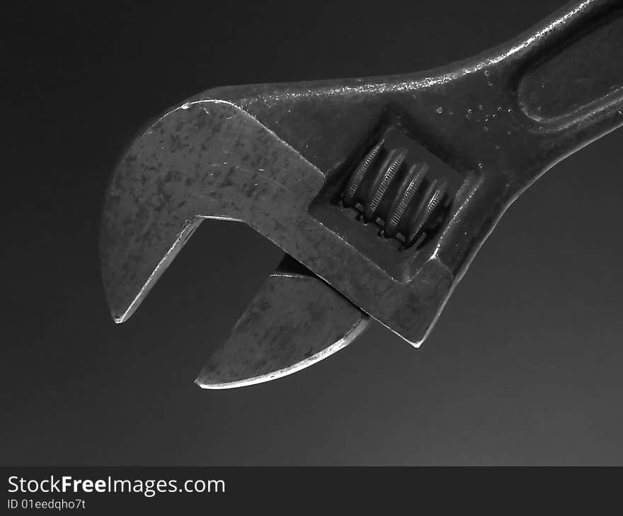 Flat wrench on dark background