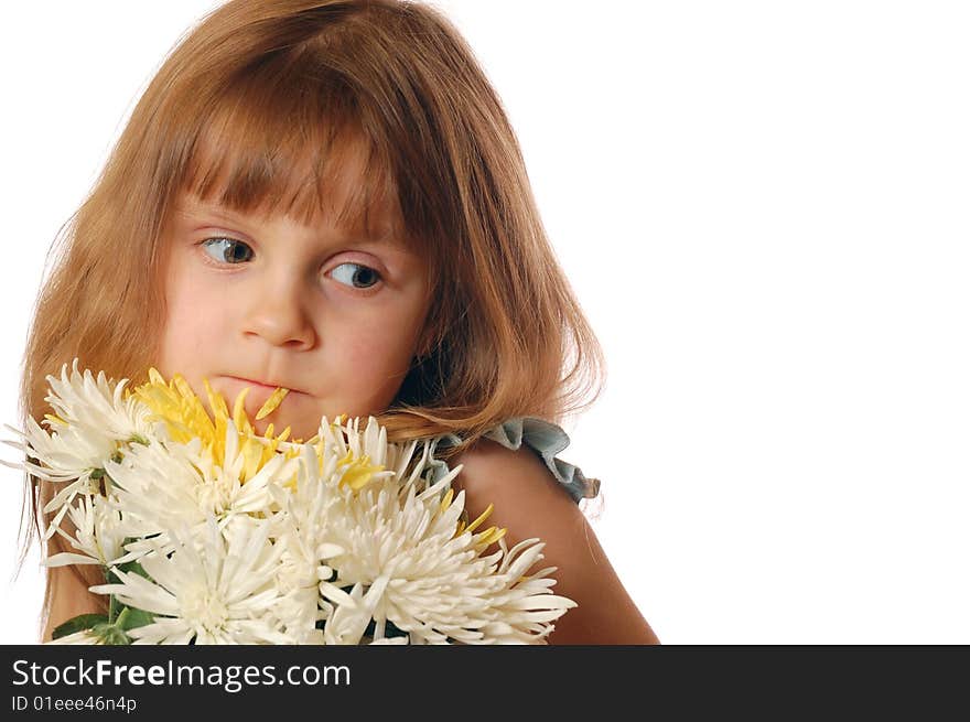 Beautiful little girl with a bunch of flowers and a pental in her lips. Copy Space. Beautiful little girl with a bunch of flowers and a pental in her lips. Copy Space.