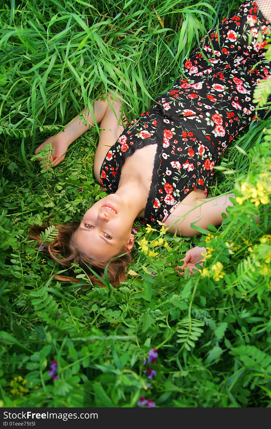 Beautiful girl lies in the grass. Beautiful girl lies in the grass