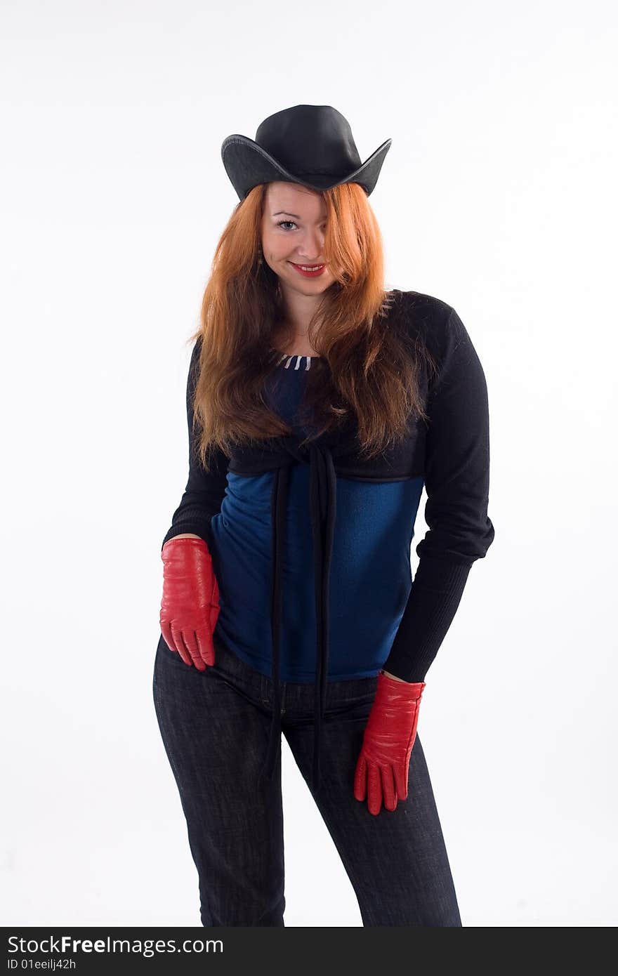 Young girl with red gloves and black hat standing on white background. Young girl with red gloves and black hat standing on white background