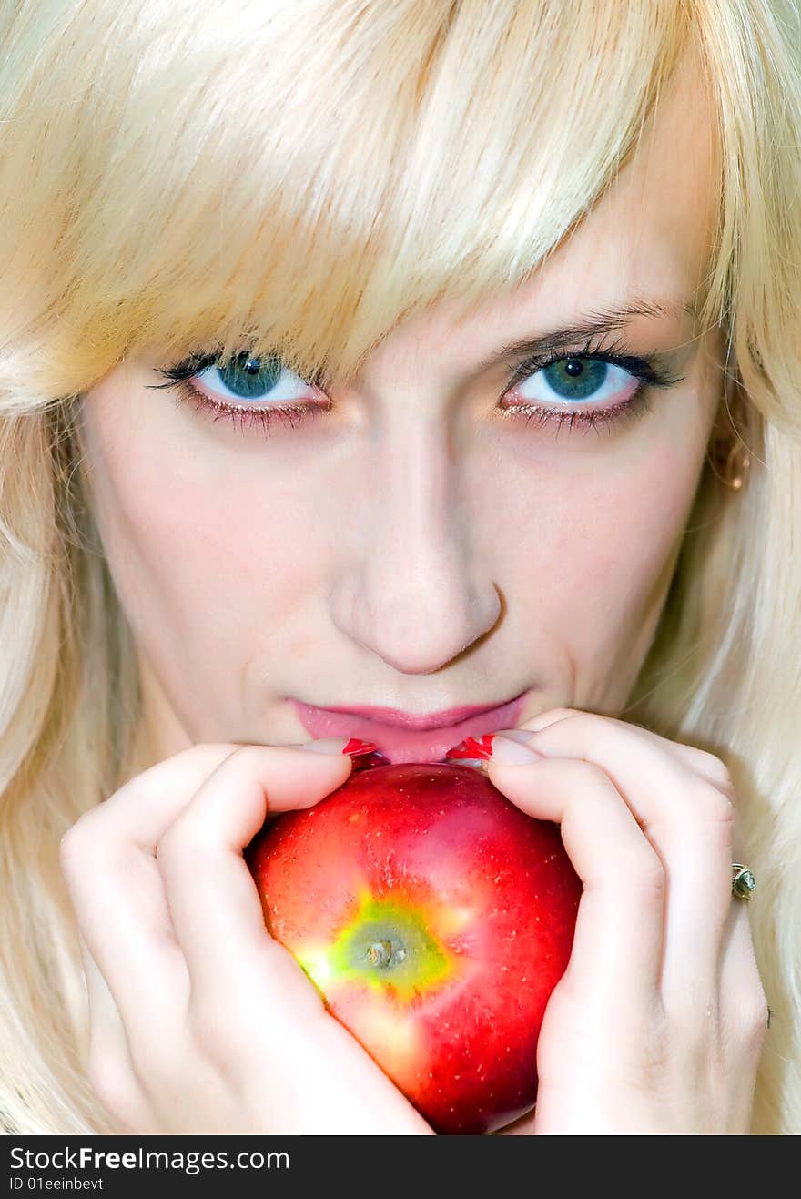 Attractive girl with apple in her hand