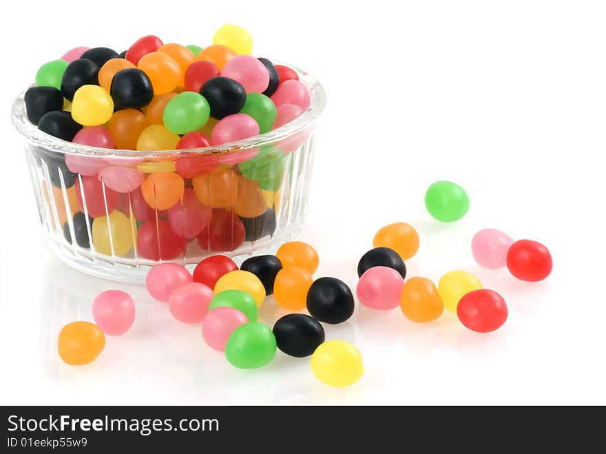 Bowl of glass filled with jellybeans isolated on white. Bowl of glass filled with jellybeans isolated on white.