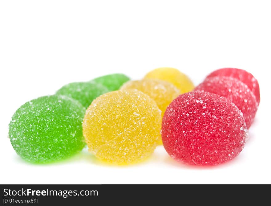 Sweet fruit color candy on white background