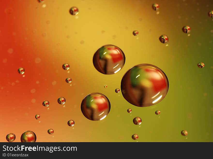 Clean waterdrops on green - red background. Clean waterdrops on green - red background