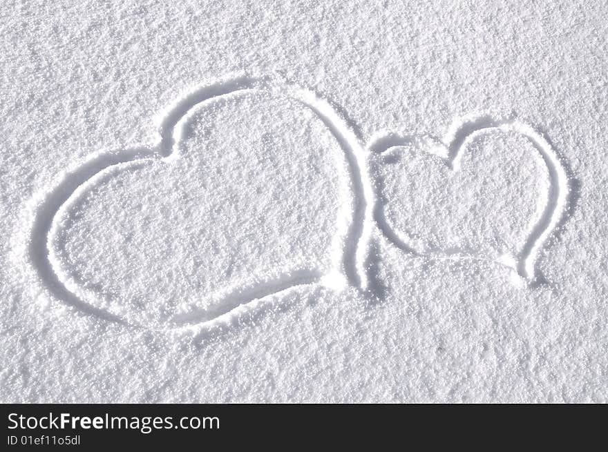 Two hearts drawn on the snow. Two hearts drawn on the snow