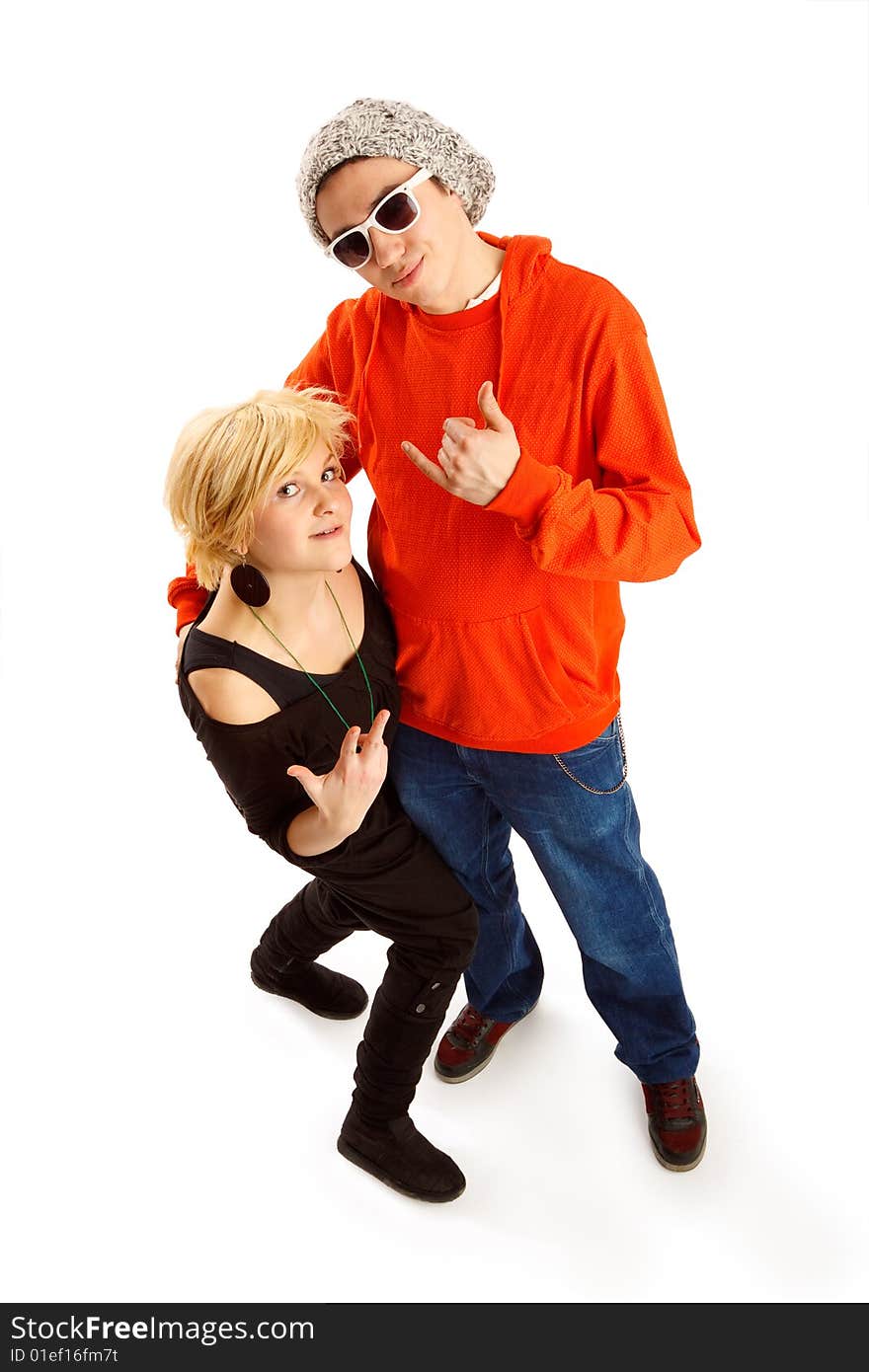 Happy young couple having fun in the studio, wide angle shot