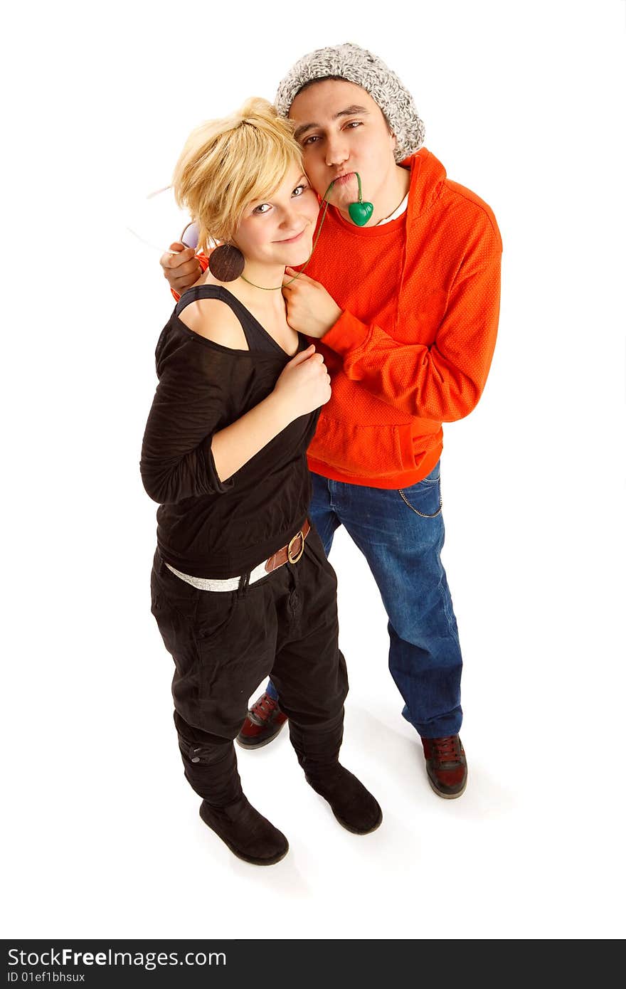 Happy young couple having fun in the studio, wide angle shot