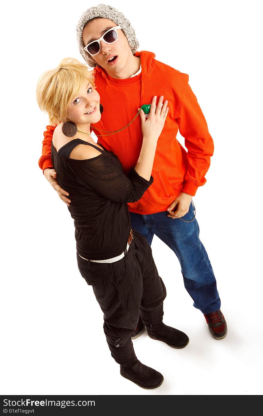 Happy young couple having fun in the studio, wide angle shot