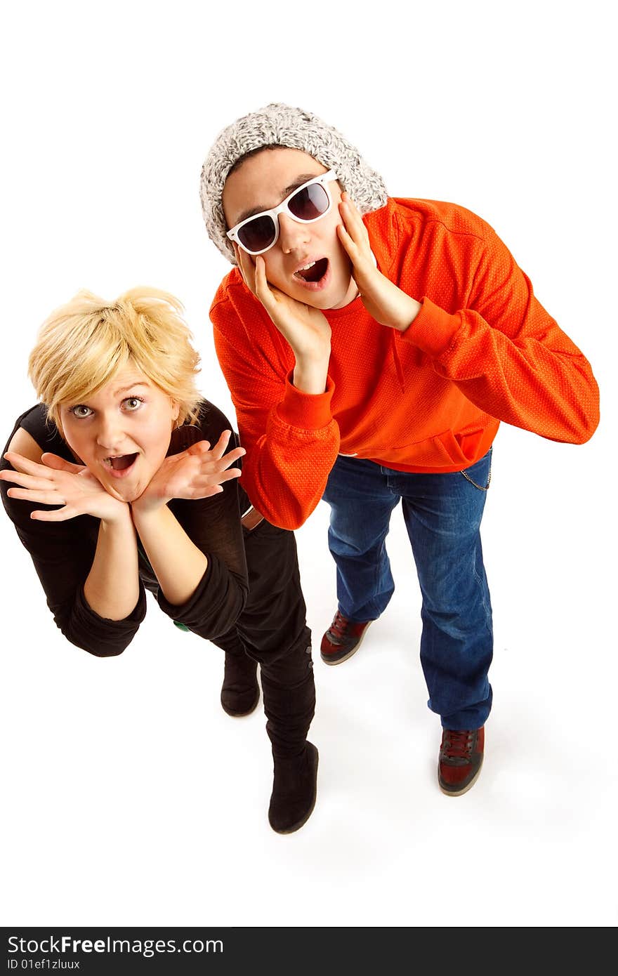 Happy young couple having fun in the studio, wide angle shot