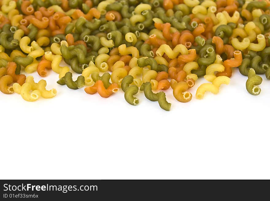 Colorful noodles frame on a white background. Soft focus. Colorful noodles frame on a white background. Soft focus