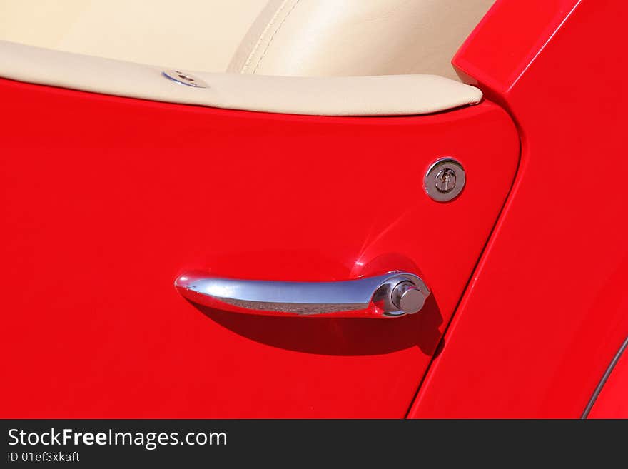 Closeup bright red sports car. Closeup bright red sports car