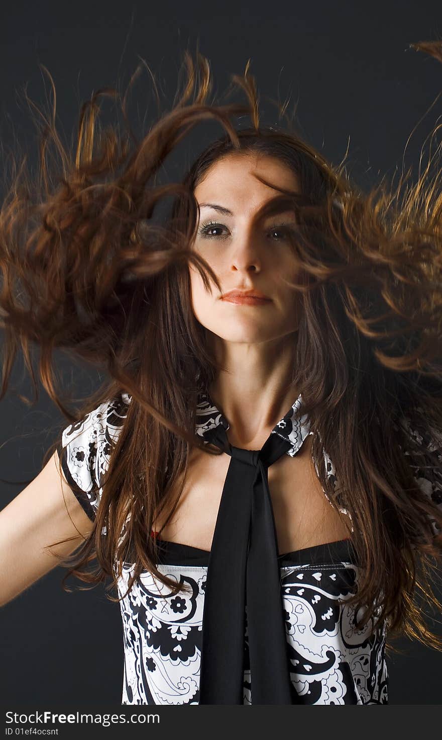 closeup portrait of woman dancing and flipping her hair