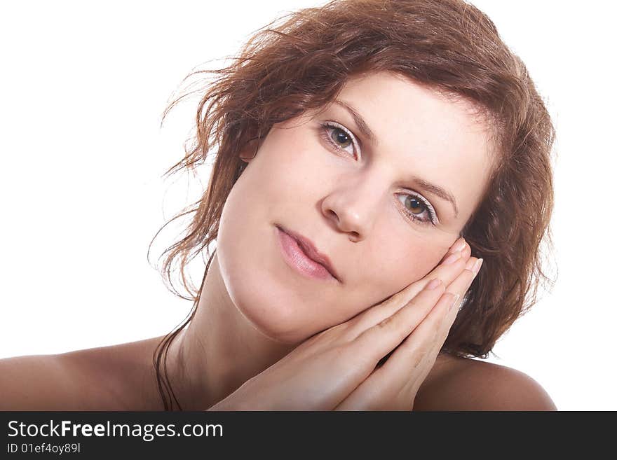 A young beautiful woman smiling at the spa. Isolated over white with a lot of copy space.