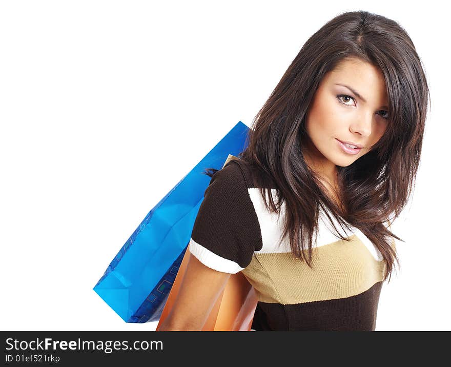 Attractive young woman with paper shopping bags. Attractive young woman with paper shopping bags