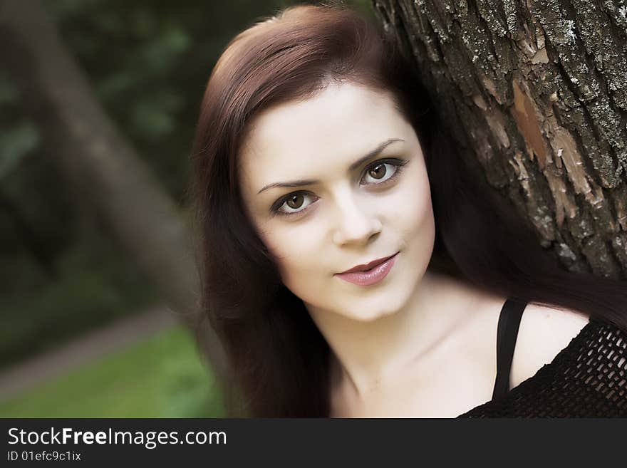 Close-up portrait of a young girl during her walk in a park. Close-up portrait of a young girl during her walk in a park