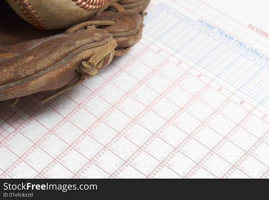 A picture of a ball and glove on a scorebook. A picture of a ball and glove on a scorebook