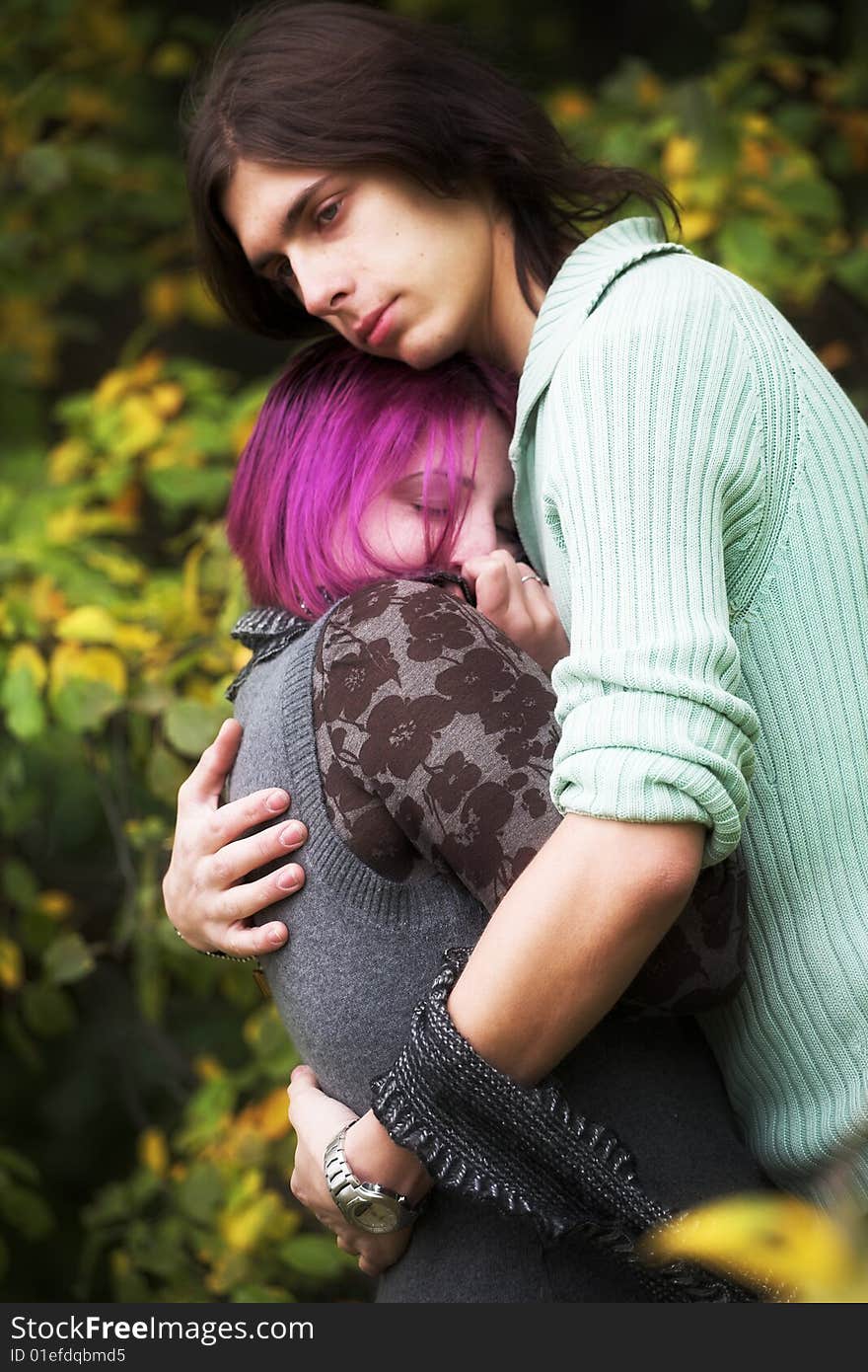 Attractive man and woman couple in love in the park. Attractive man and woman couple in love in the park