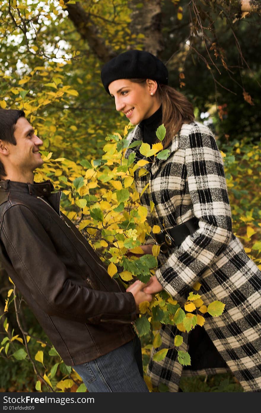 Young Couple In Autumn Park