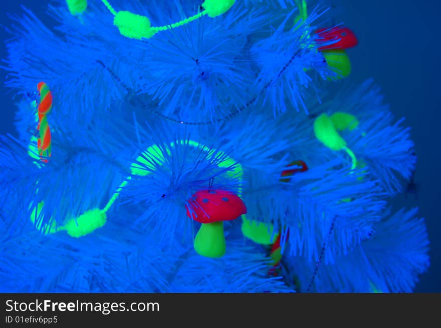 Unusual Christmas tree in a blacklight. Unusual Christmas tree in a blacklight